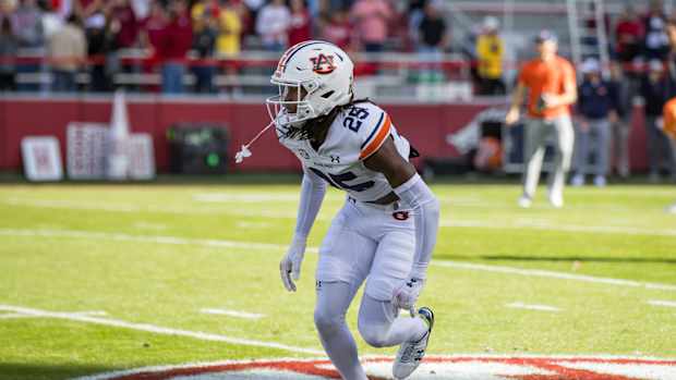 Nov 11, 2023; Fayetteville, Arkansas, USA; Auburn Tigers cornerback Champ Anthony (25) warms up before the game against the Arkansas Razorbacks at Donald W. Reynolds Razorback Stadium. Mandatory Credit: Brett Rojo-USA TODAY Sports 